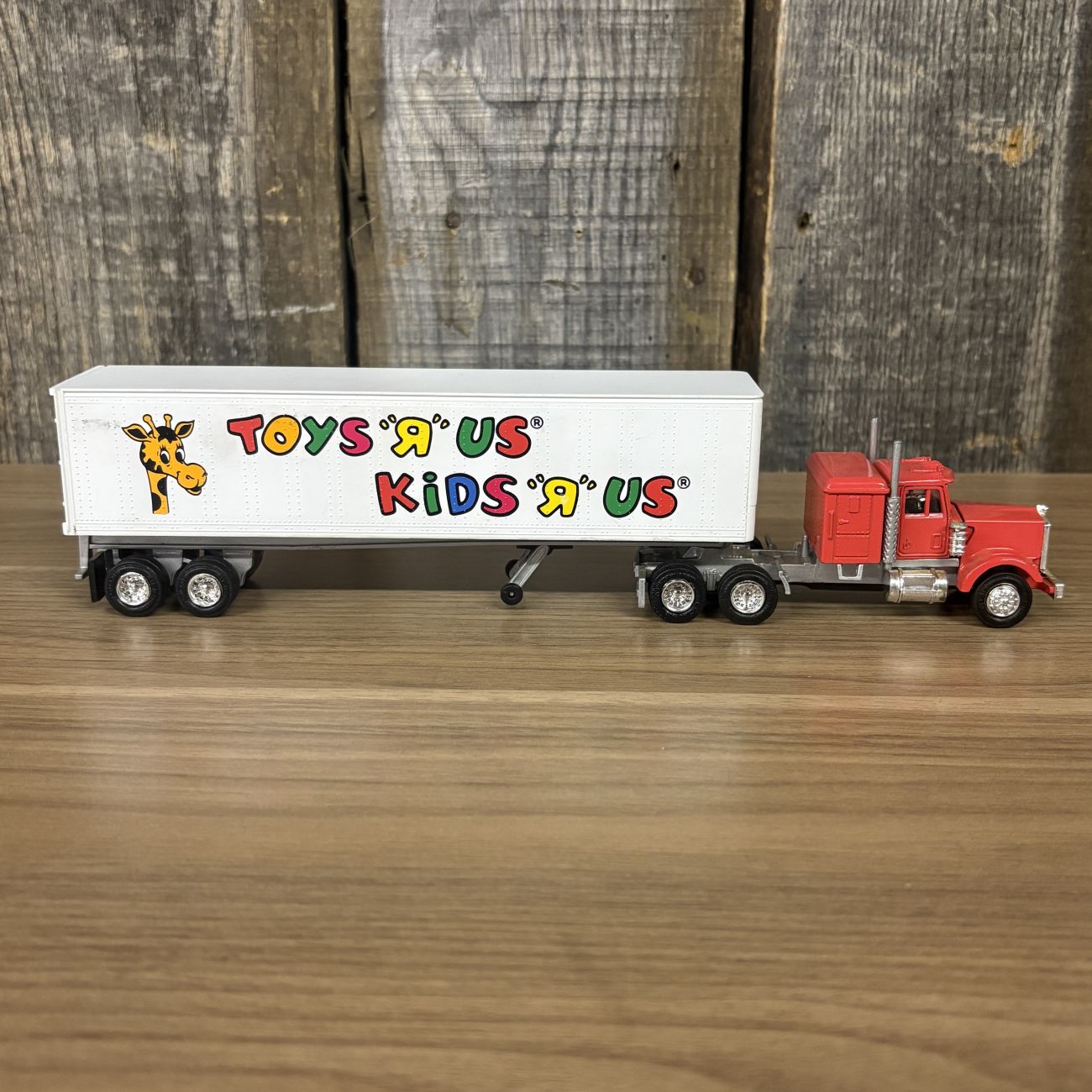 A Pair of Lionel Die-cast Semi-Tractor Trailers with Toys R Us and Alka-Seltzer Branding