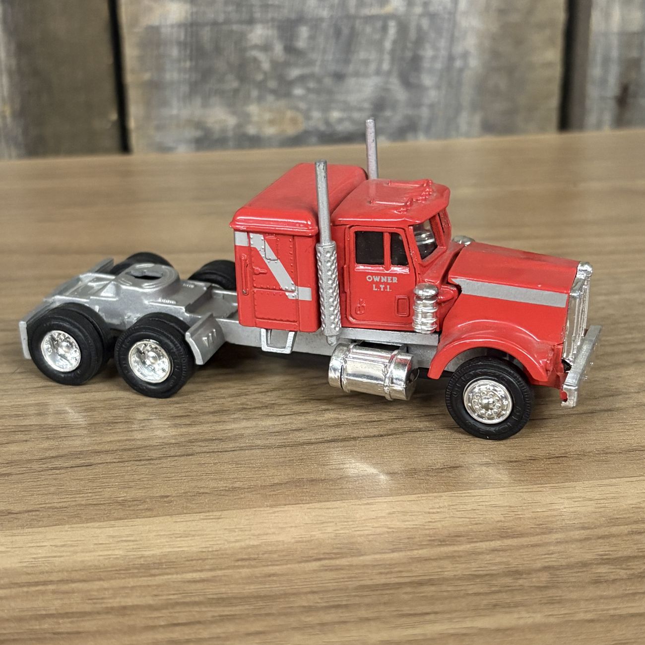 A Collection of Five Vintage Semi-Tractor Cabs and Fire Engine by Lionel, GATA, and Szetoy