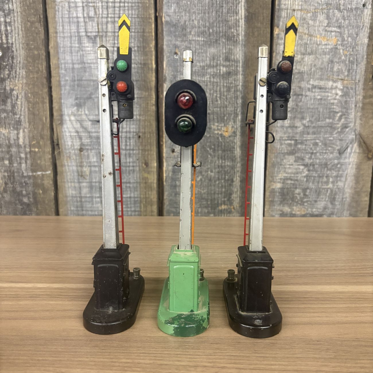 Three Lionel No. 151 Semaphore and No. 153 Block Signal Train Accessories