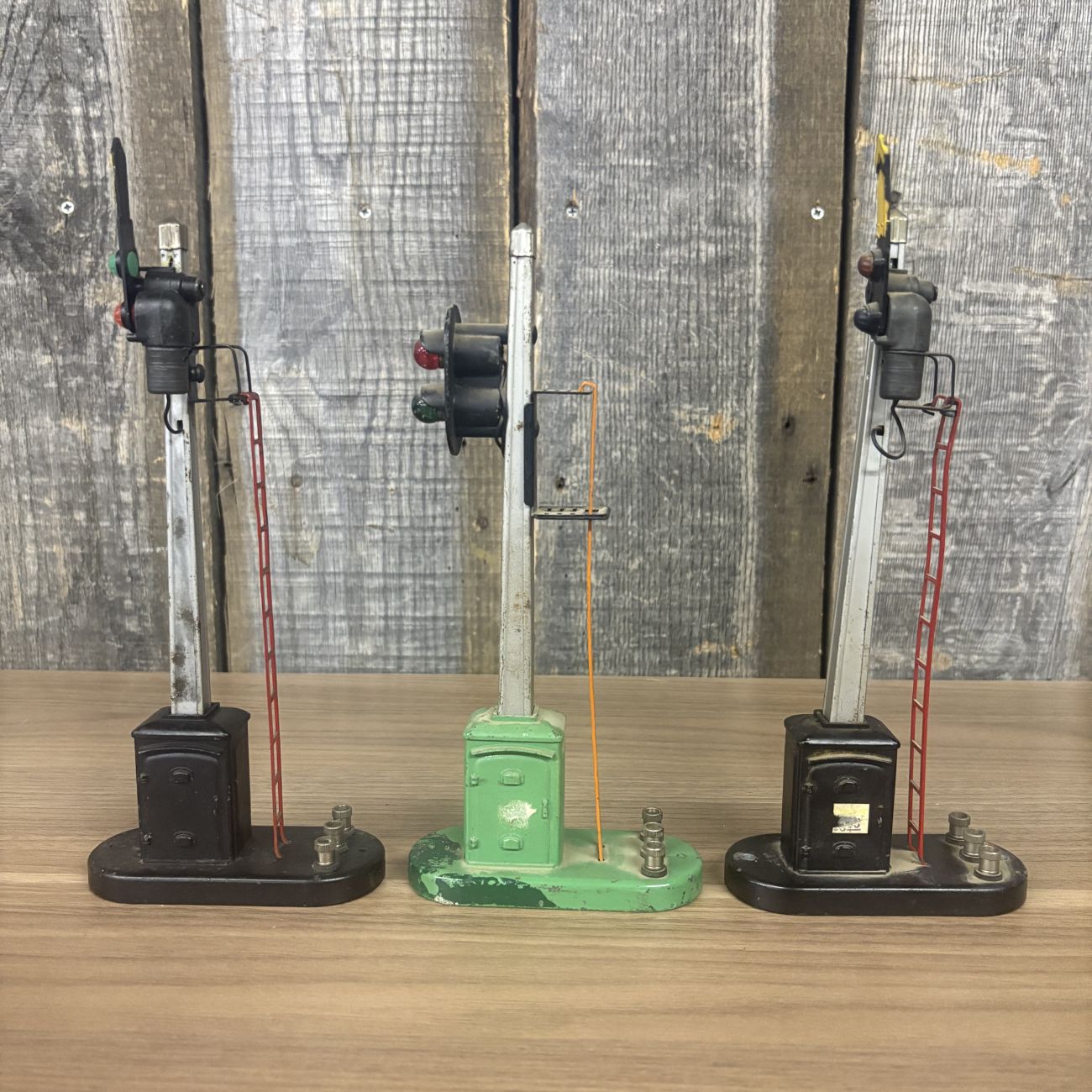 Three Lionel No. 151 Semaphore and No. 153 Block Signal Train Accessories