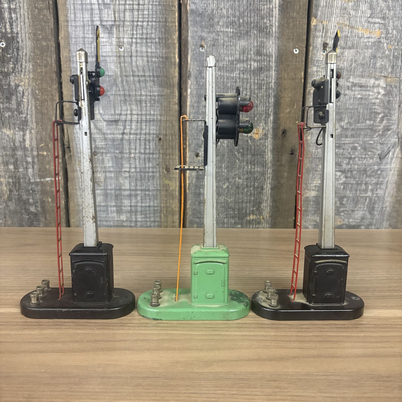 Three Lionel No. 151 Semaphore and No. 153 Block Signal Train Accessories