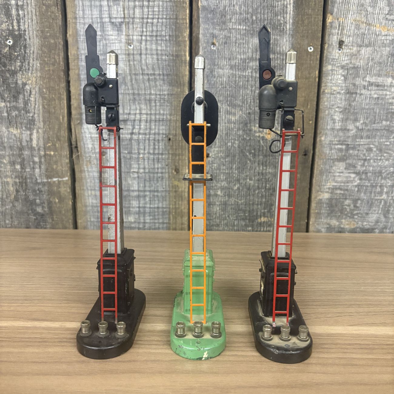 Three Lionel No. 151 Semaphore and No. 153 Block Signal Train Accessories