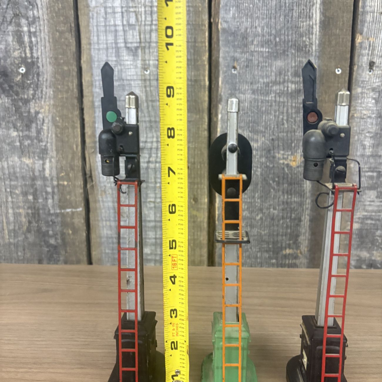 Three Lionel No. 151 Semaphore and No. 153 Block Signal Train Accessories