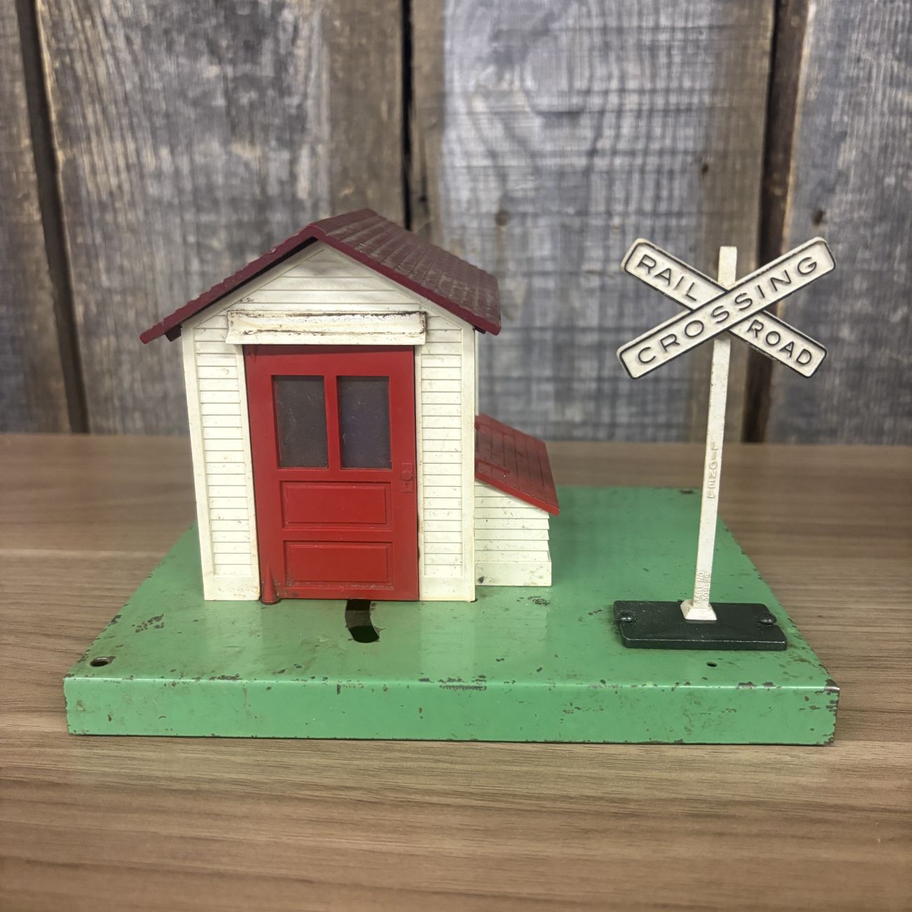 A Pair of Lionel No. 45 and No. 45N Gateman Accessories