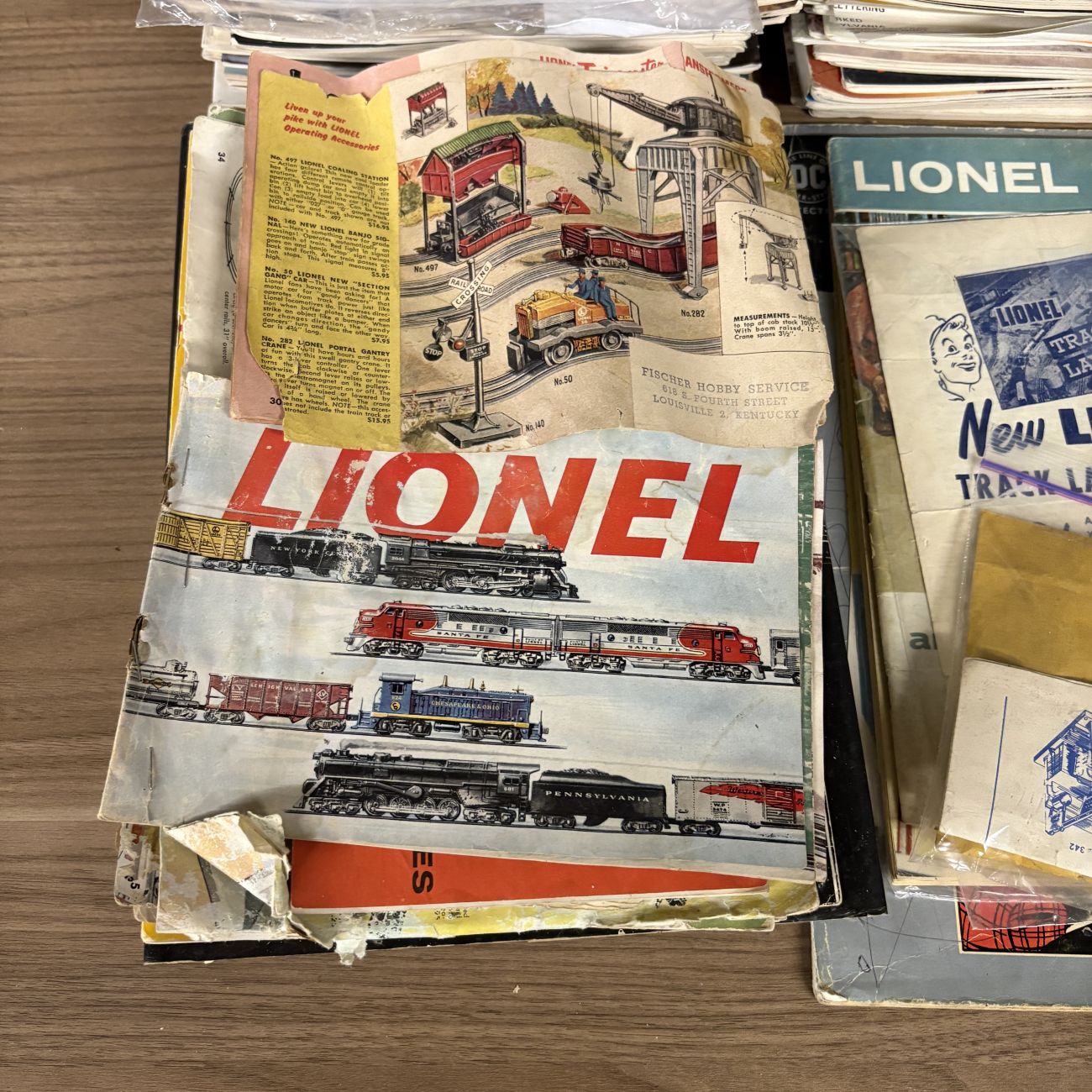 A Collection of Classic Toy Trains and Model Railroader Magazines with Vintage Lionel Ephemera