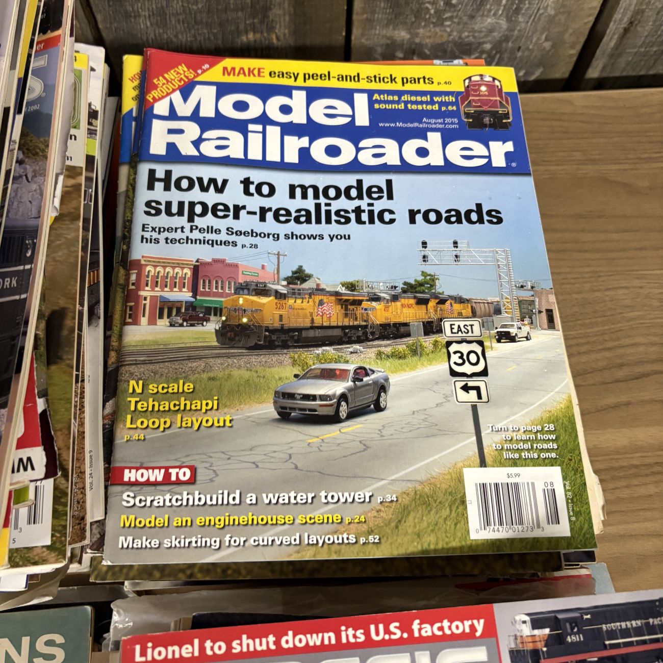 A Collection of Classic Toy Trains and Model Railroader Magazines with Vintage Lionel Ephemera