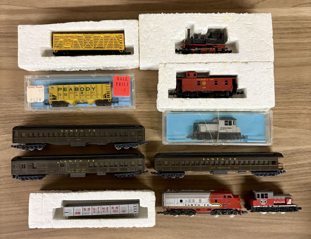 A Collection of Eleven Vintage N-Scale Model Train Locomotives and Rolling Stock Including Lima and Atlas Examples