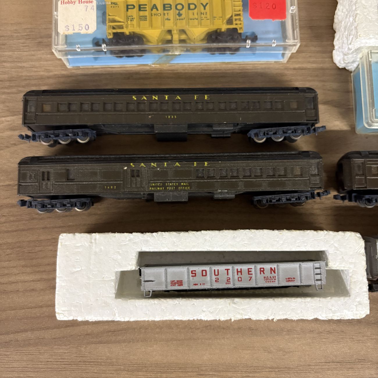 A Collection of Eleven Vintage N-Scale Model Train Locomotives and Rolling Stock Including Lima and Atlas Examples