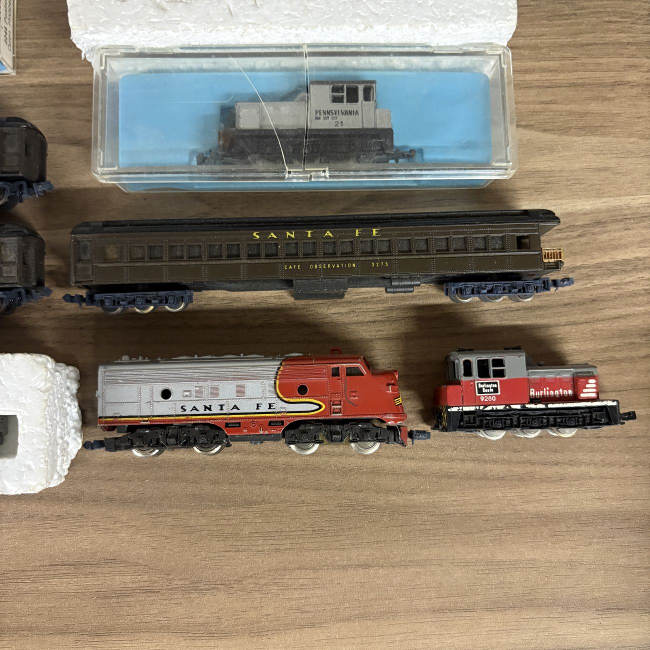 A Collection of Eleven Vintage N-Scale Model Train Locomotives and Rolling Stock Including Lima and Atlas Examples