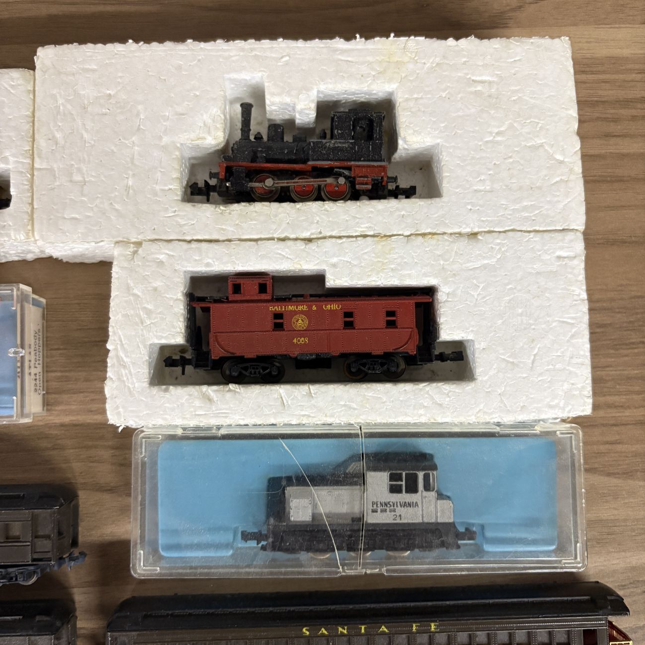 A Collection of Eleven Vintage N-Scale Model Train Locomotives and Rolling Stock Including Lima and Atlas Examples