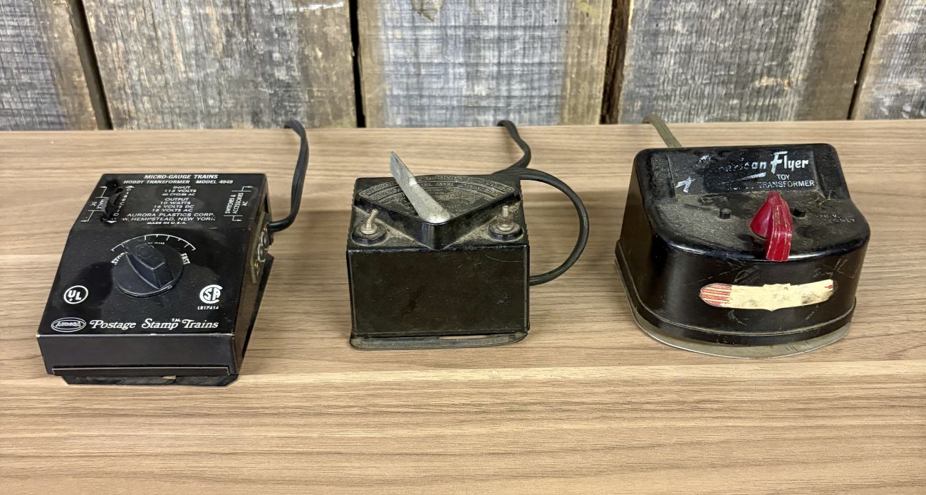 Three Vintage Toy Train Transformers by Aurora, A.C. Gilbert, and American Flyer