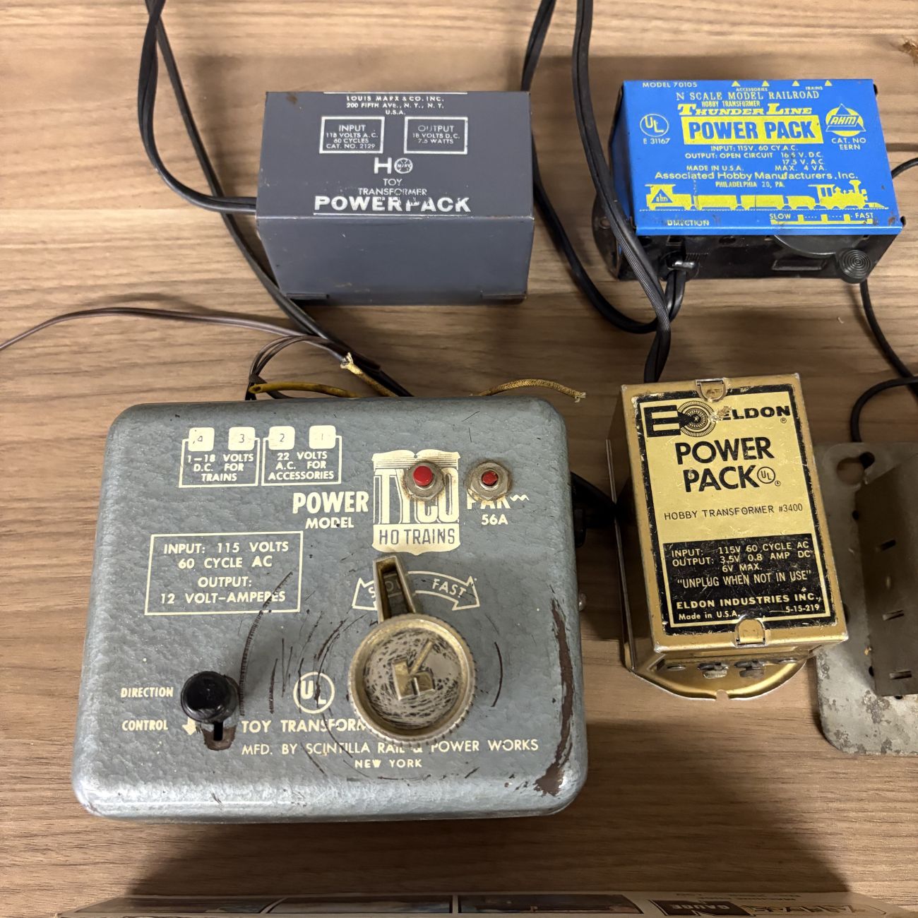 An Assortment of Vintage HO and N Scale Model Train Transformers, Rolling Stock, and Track Accessories
