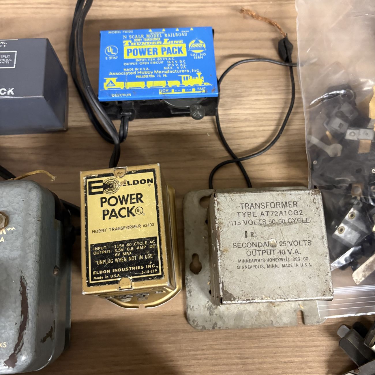 An Assortment of Vintage HO and N Scale Model Train Transformers, Rolling Stock, and Track Accessories
