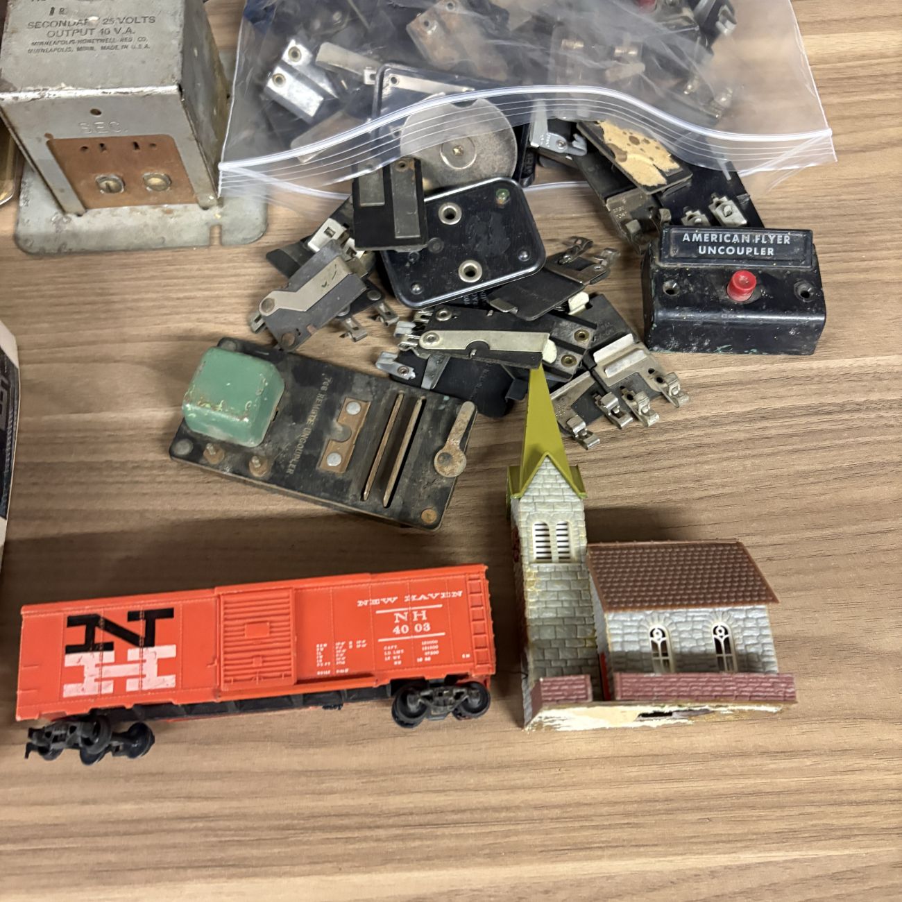 An Assortment of Vintage HO and N Scale Model Train Transformers, Rolling Stock, and Track Accessories