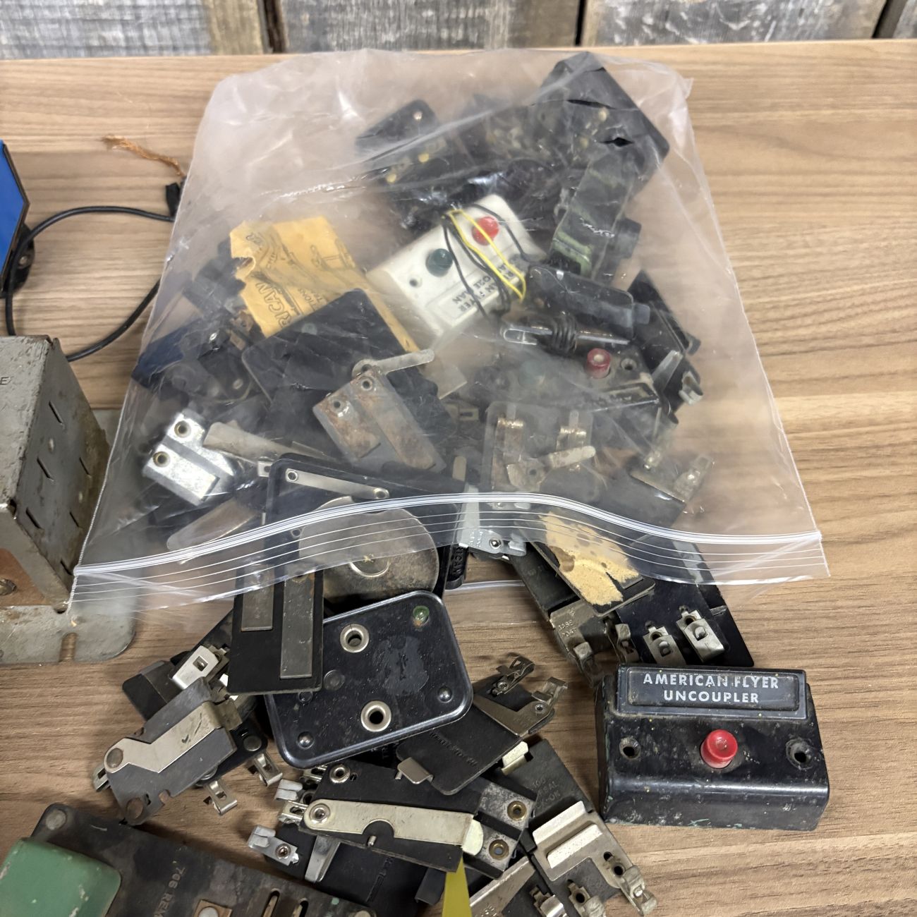 An Assortment of Vintage HO and N Scale Model Train Transformers, Rolling Stock, and Track Accessories