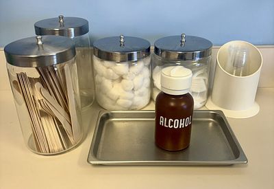 An Assortment of Pyrex and Corning Glass Apothecary Jars and Clinical Medical Supplies. An 