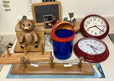 An Assortment of Home Decor Including Ingraham Clocks and Bear Figurines. This lot features an 