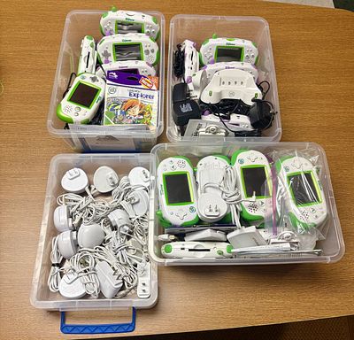 A Collection of LeapFrog Leapster Explorer Handheld Learning Systems and Accessories. An 