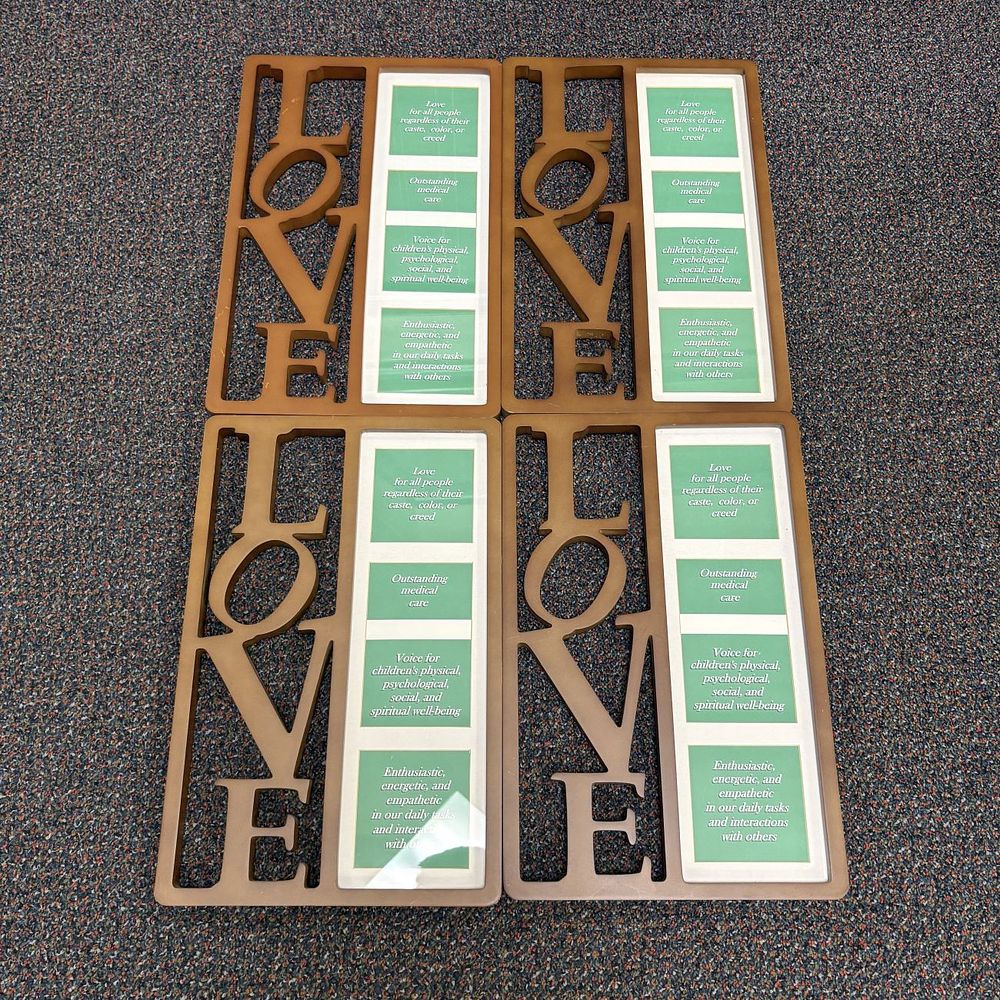 Lot 260: A Set of Four LOVE Decorative Mission Statement Frames