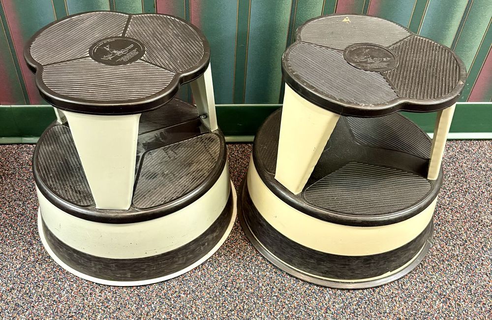 Lot 368: A Pair of Cramer Kik-Step Steel Rolling Library Stools