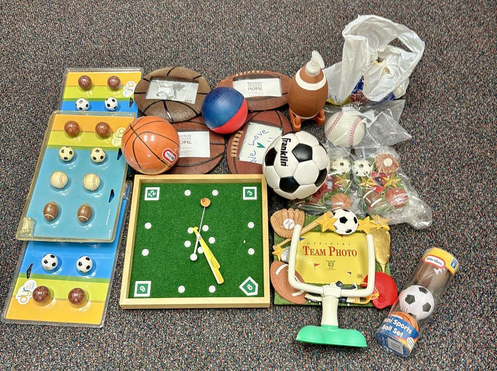 Lot 430: An Assortment of Sports Themed Home Decor and Toys Including Little Tikes and Franklin