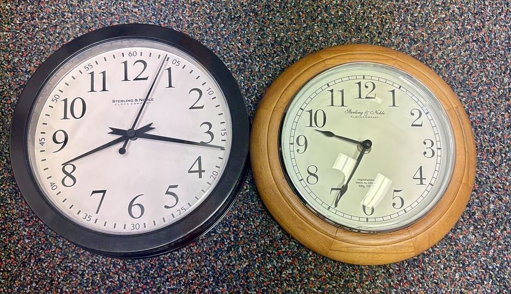 Lot 437: A Pair of Sterling & Noble Clock Company Wall Clocks