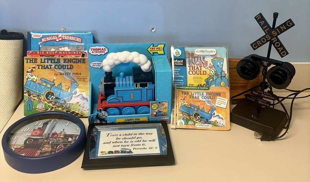 Lot 453: Fisher-Price Talking Thomas Toy, Books & Railroad Crossing Lamp Train Collection