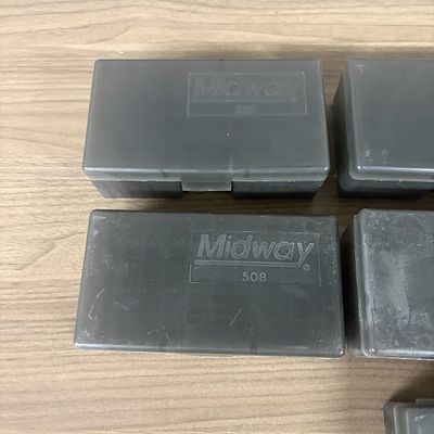 A Collection of Midway Plastic Ammunition Storage Cases. A collection of translucent smoke gray 