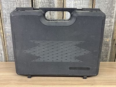 Doskocil Black Plastic Hard Shell Carrying Case. A black plastic hard-shell carrying case with a 