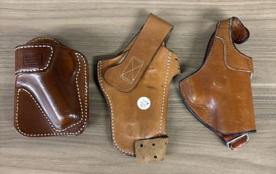 A Trio of Vintage Leather Pistol Holsters Including Milt Sparks and Safariland Examples. A trio 