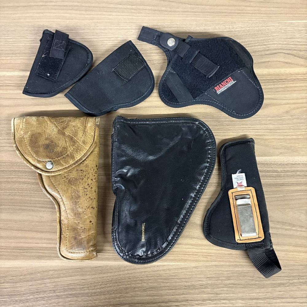 Lot 250: An Assortment of Firearm Holsters and a Browning Pouch