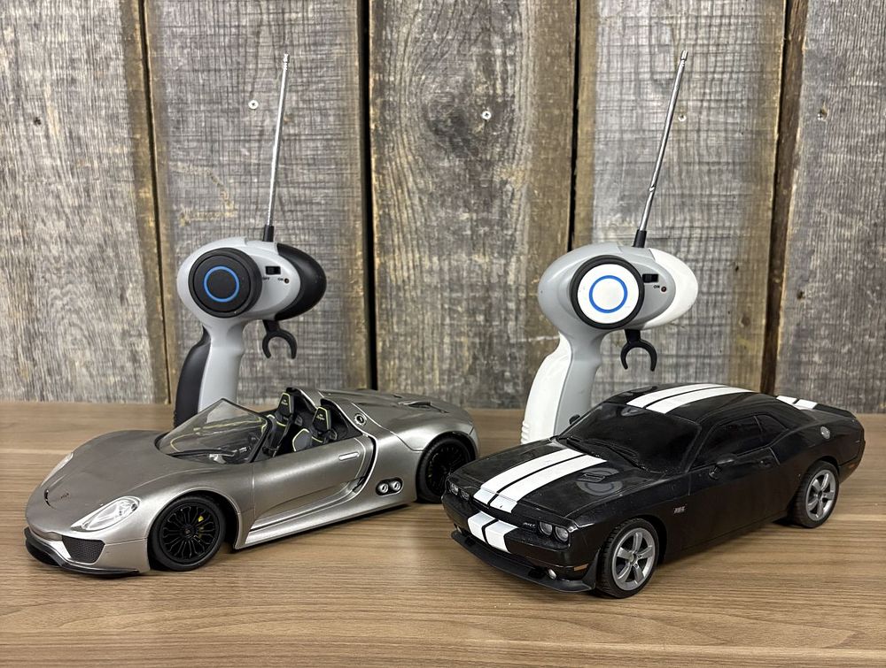 Lot 317: Two Auldey Remote Controlled Toy Cars with Transmitters