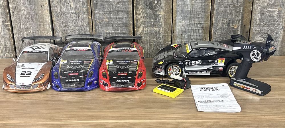 Lot 320: A Collection of Extreme Drift 2.4G Radio Controlled Race Cars and Accessories