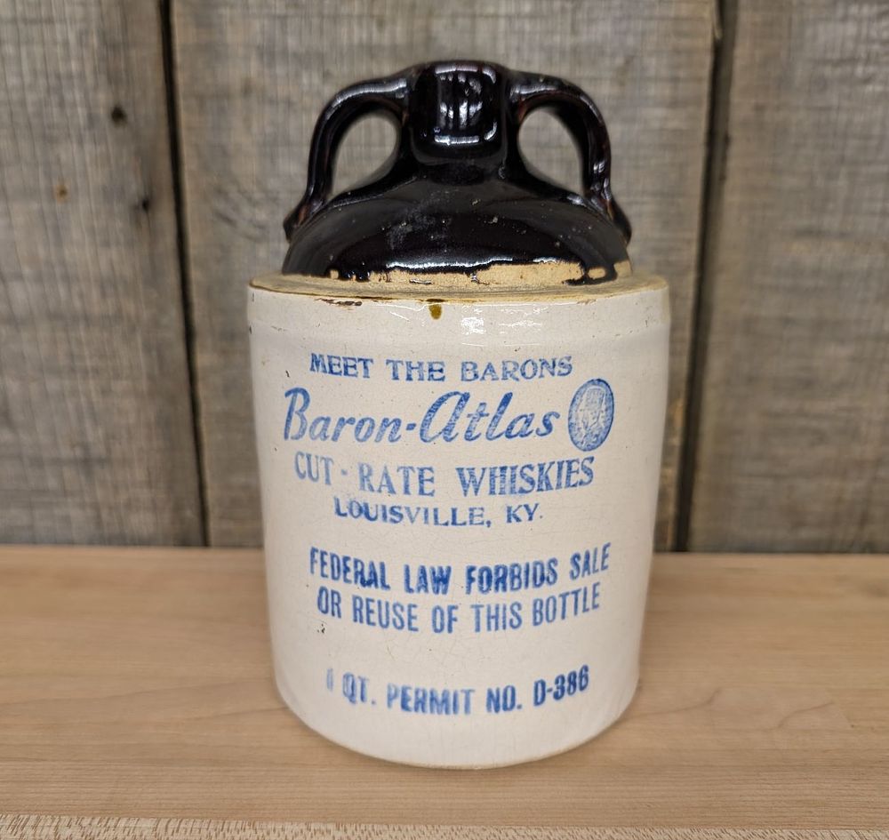 Lot 373: Baron-Atlas Cut-Rate Whiskies Two-Handled Stoneware Jug
