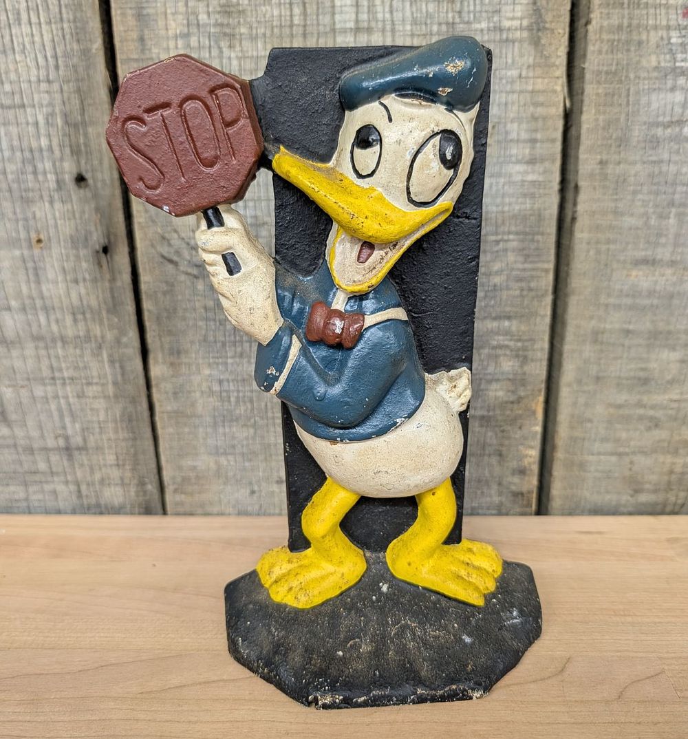 Lot 376: Cast Iron Donald Duck Stop Sign Doorstop