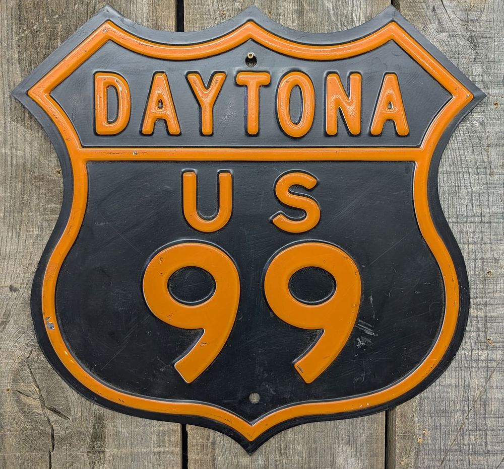 Lot 398: Premier Signs Limited Edition Embossed Metal Daytona US 99 Shield Sign