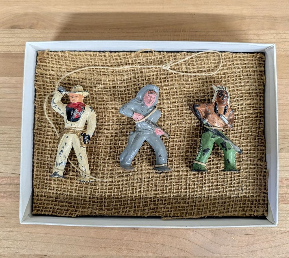 Lot 404: Three Vintage Cast Lead Cowboy and Native American Figures
