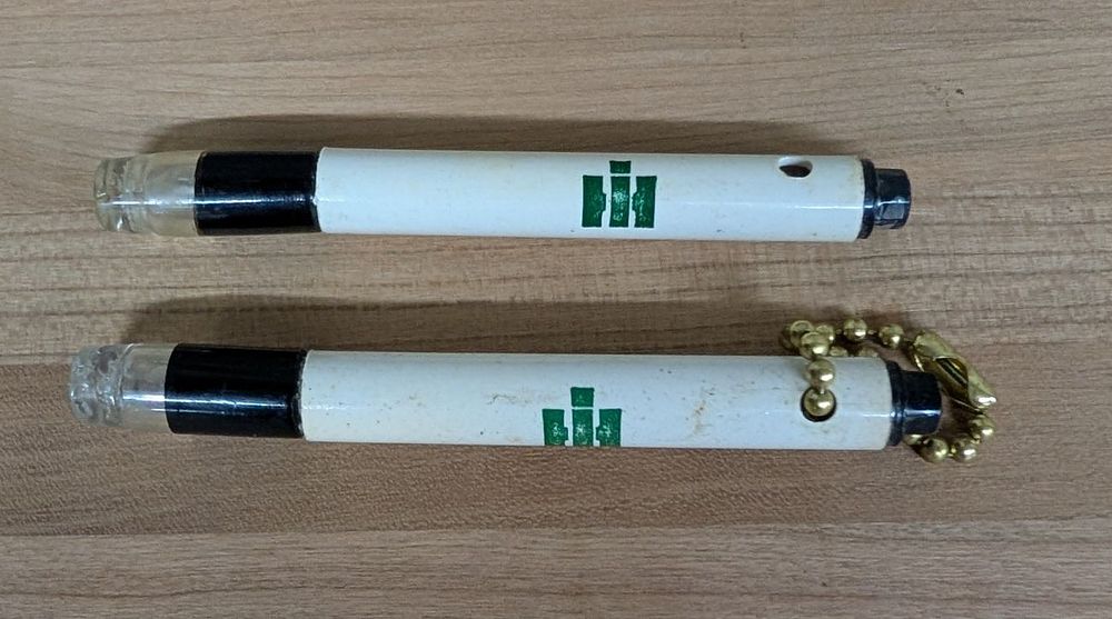 Lot 409: A Pair of Vintage International Harvester Louisville Plant Safety Promotional Pocket Flashlights