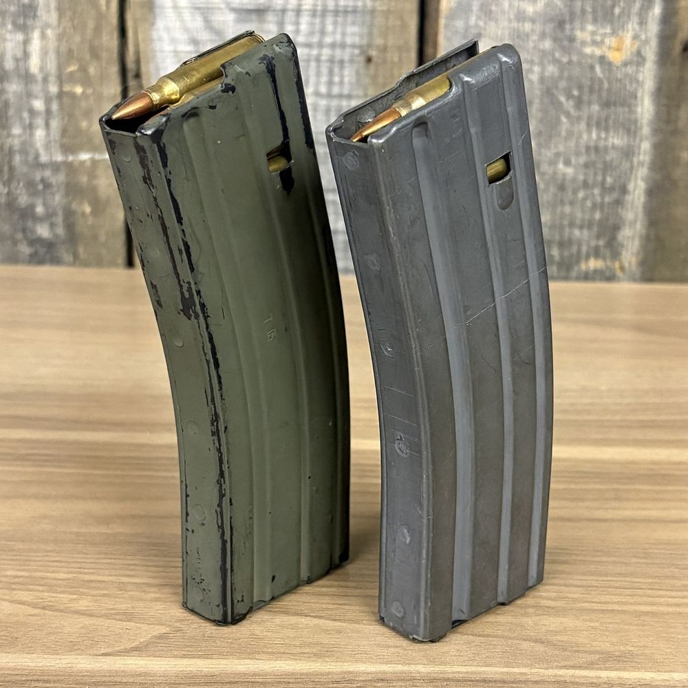 Lot 528: Two 30 Round Aluminum AR-15 M16 Magazines including D & H Industries Restricted Example