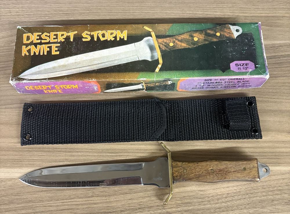 Lot 533: A Pakistan Stainless Steel Desert Storm Commemorative Dagger with Original Box and Sheath