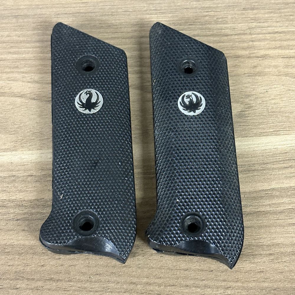 Lot 549: A Group of Black Checkered Synthetic Pistol Grip Panels with Bird Emblem Medallions