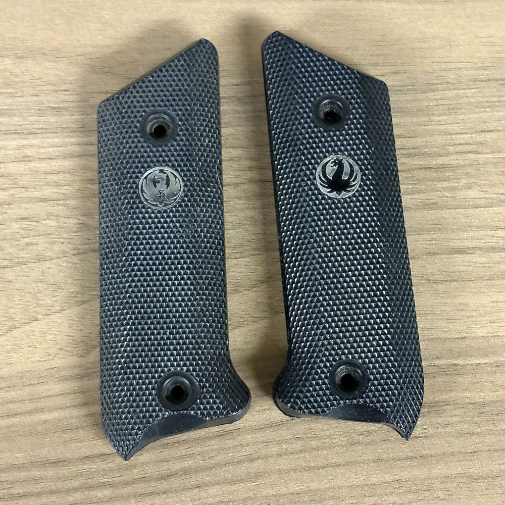 Lot 550: Two Pairs of Checkered Black Polymer Handgun Grip Panels with Silver Tone Eagle Medallions