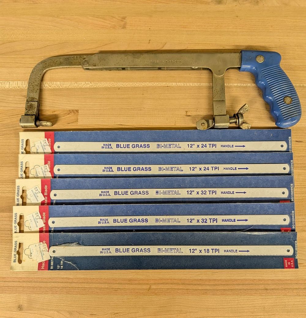 Lot 713: An American Blue Grass Adjustable Hacksaw Frame and a Collection of Bi-Metal Blades