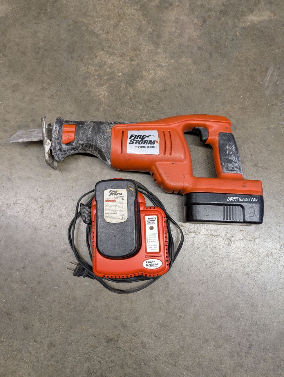Lot 735: Black and Decker FireStorm 18V Cordless Reciprocating Saw with Two Batteries and Rapid Charger