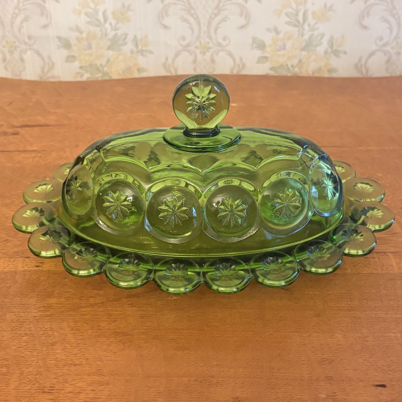 Pressed Green Glass Covered Butter Dish in Moon and Star Pattern