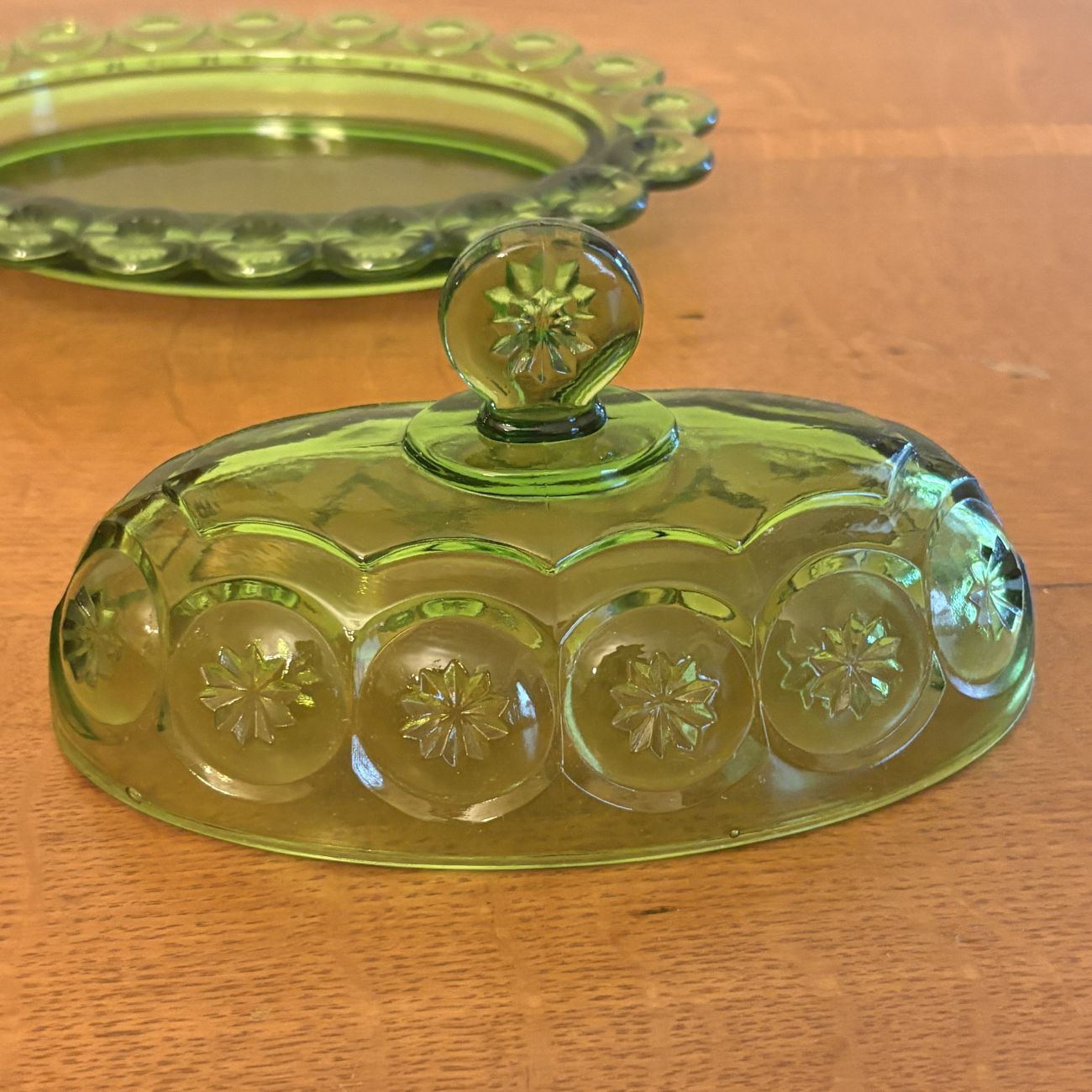 Pressed Green Glass Covered Butter Dish in Moon and Star Pattern