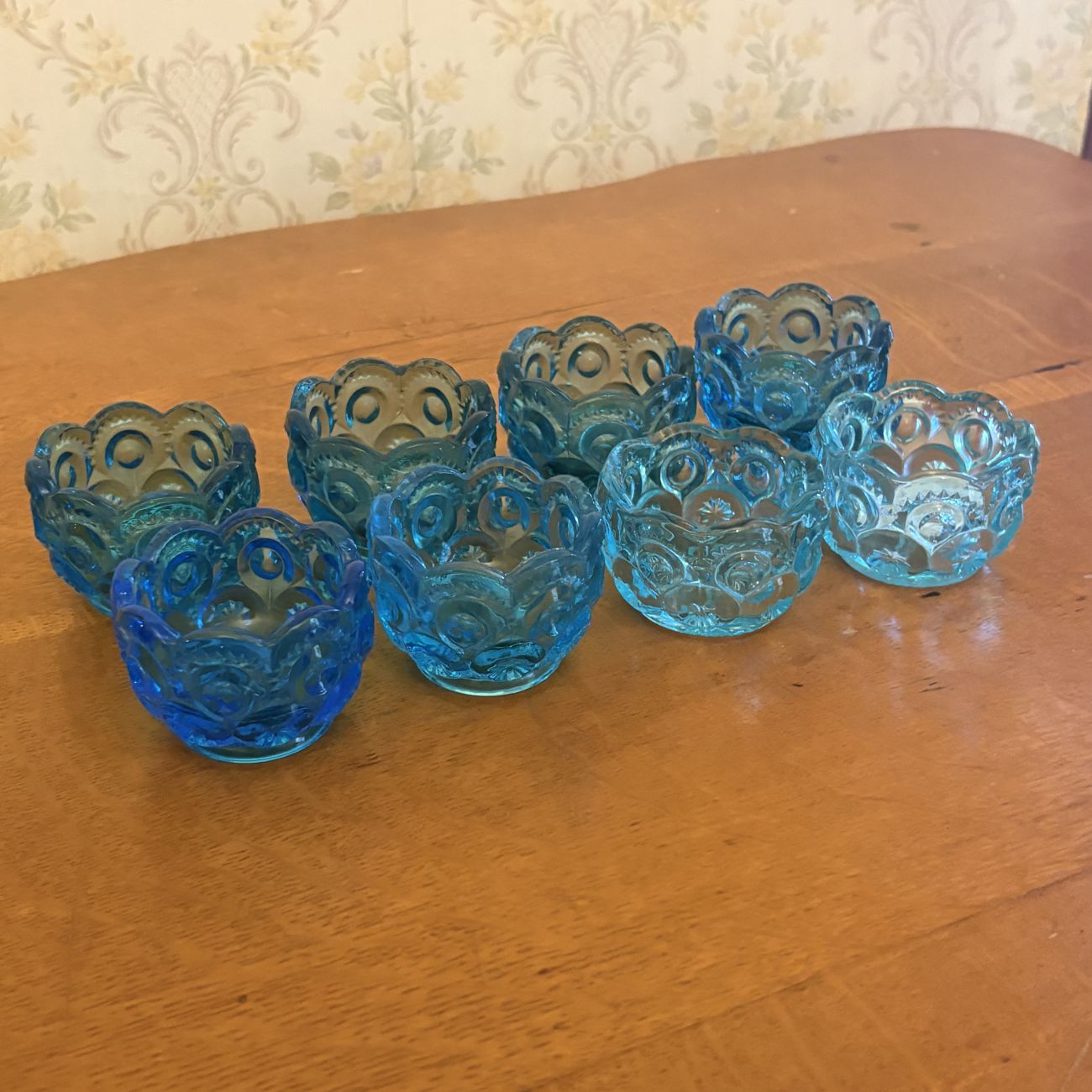A Set of Eight Moon and Star Pattern Blue Pressed Glass Salt Cellars