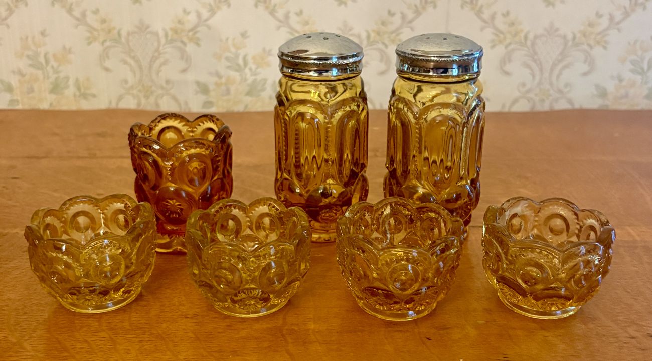 A Set of Amber Pressed Glass Moon and Star Pattern Tableware
