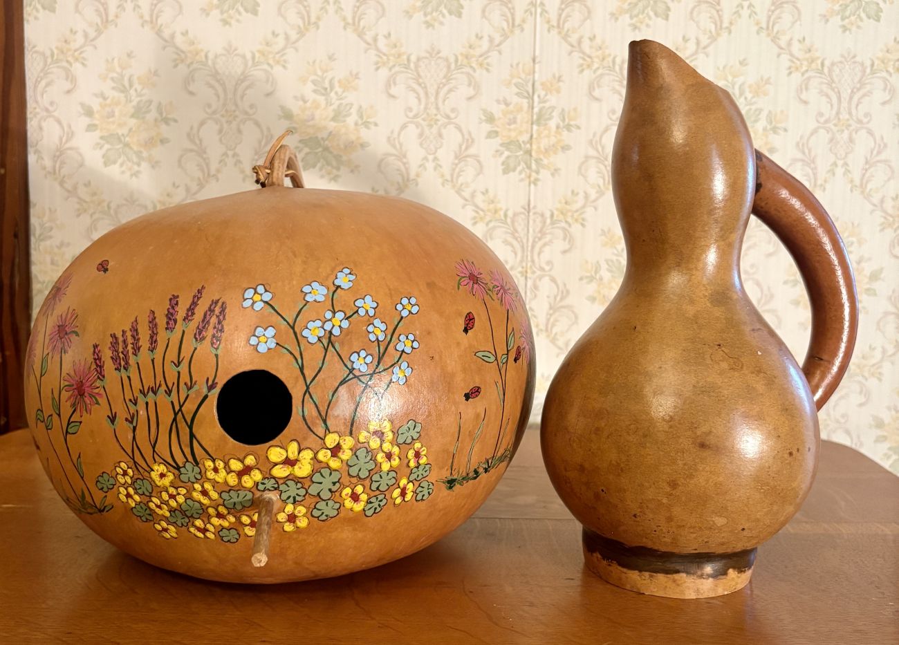Two Decorative Dried Gourd Objects Including Hand Painted Birdhouse and Pitcher