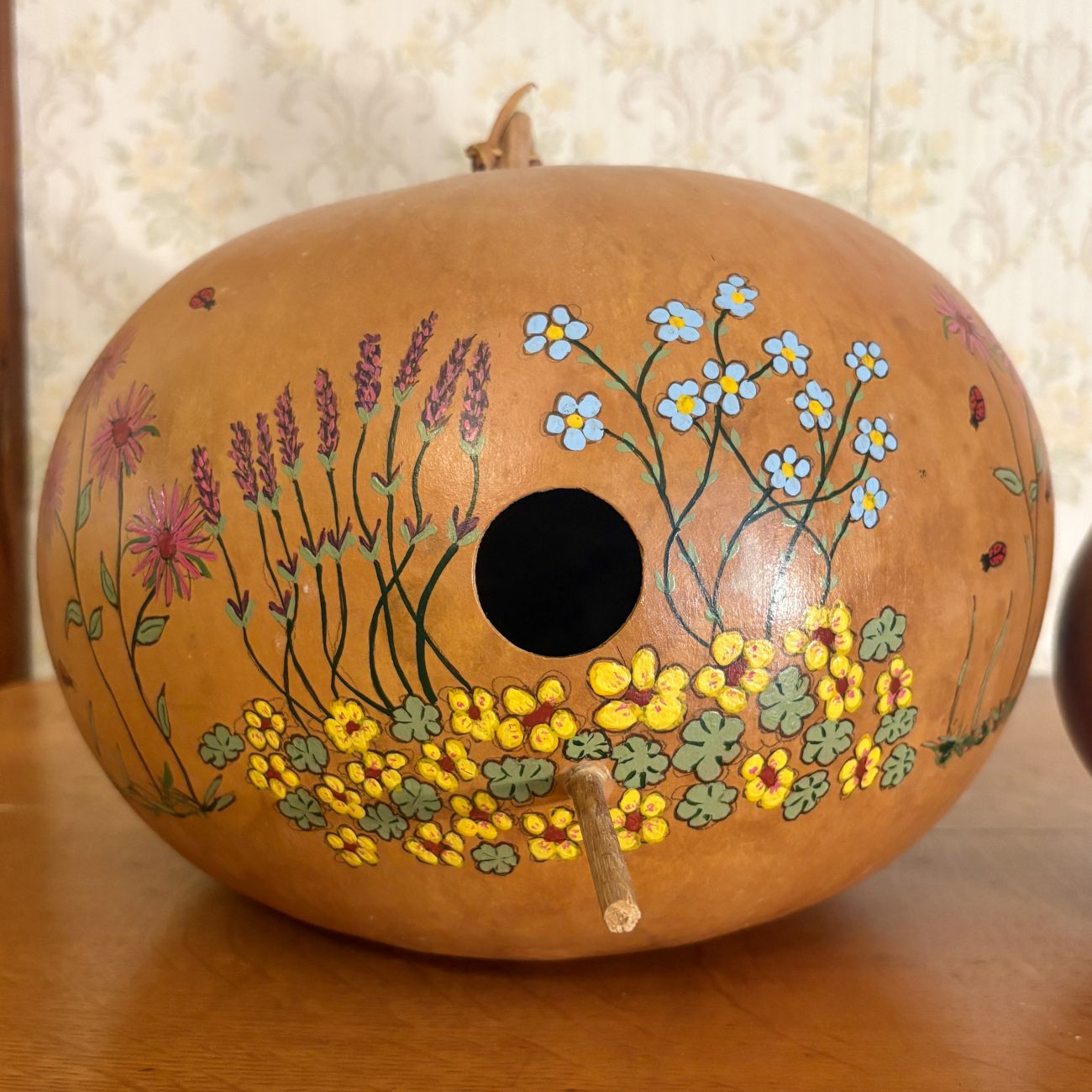 Two Decorative Dried Gourd Objects Including Hand Painted Birdhouse and Pitcher